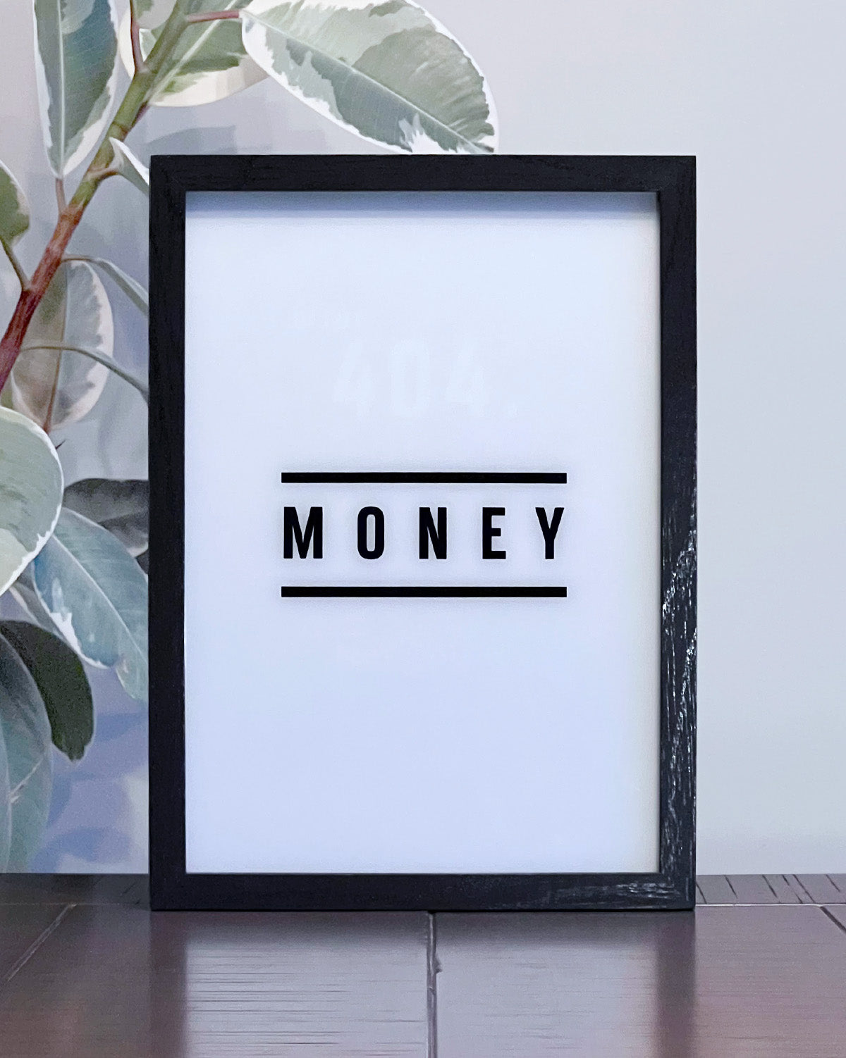 LED Light-up frame with a 'Money' design that transitions to 'Error 404 Not Found' when illuminated, offering a witty and playful twist.
